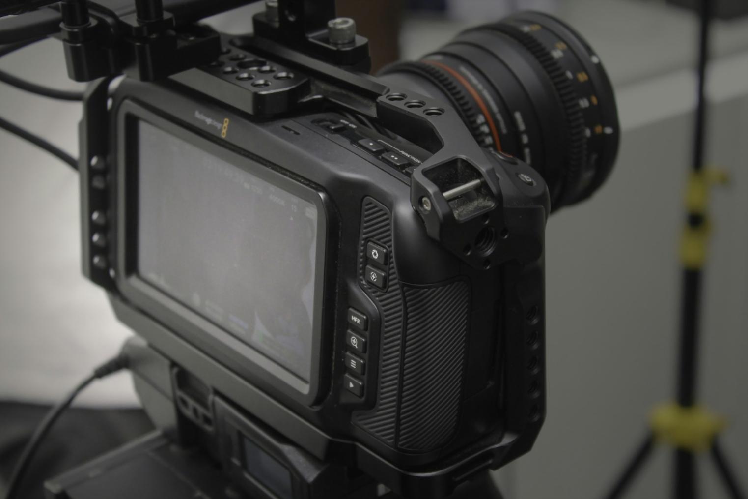 Film editing workspace with professional equipment and monitors